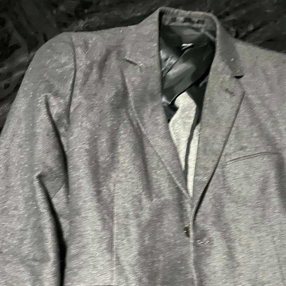 H&M black denim with light grey elbow patches.